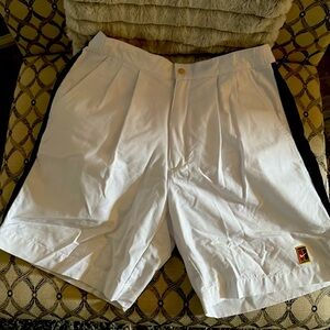 White and black size 32 men golf shorts, never worn, but does not have tag